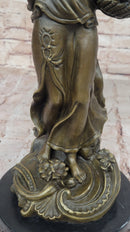 Bronze Mother and Child in Basket - Elegant Sculpture
