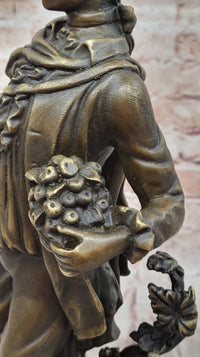 Colonial Era Man Holding Basket of Fruit - Bronze by Milo