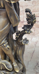 Colonial Era Man Holding Basket of Fruit - Bronze by Milo