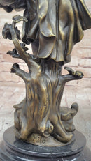 Colonial Era Man Holding Basket of Fruit - Bronze by Milo