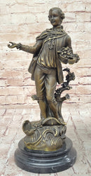 Colonial Era Man Holding Basket of Fruit - Bronze by Milo