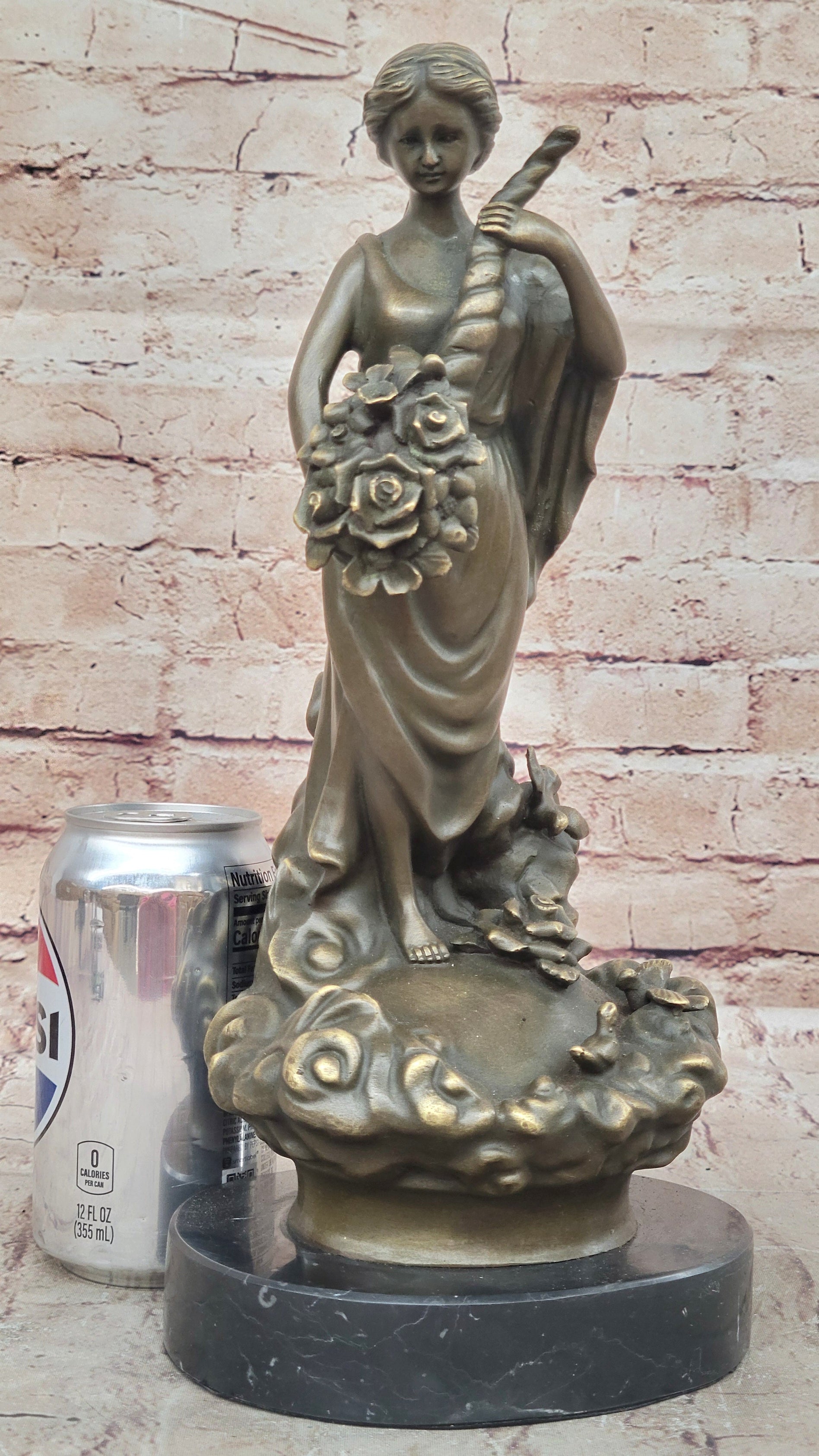 Female Figure Holding a Floral Cornucopia - Bronze Sculpture by Milo