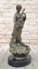 Female Figure Holding a Floral Cornucopia - Bronze Sculpture by Milo