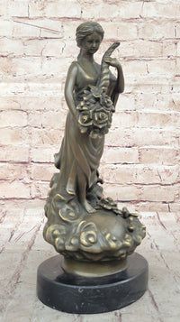 Female Figure Holding a Floral Cornucopia - Bronze Sculpture by Milo