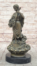 Female Figure Holding a Floral Cornucopia - Bronze Sculpture by Milo