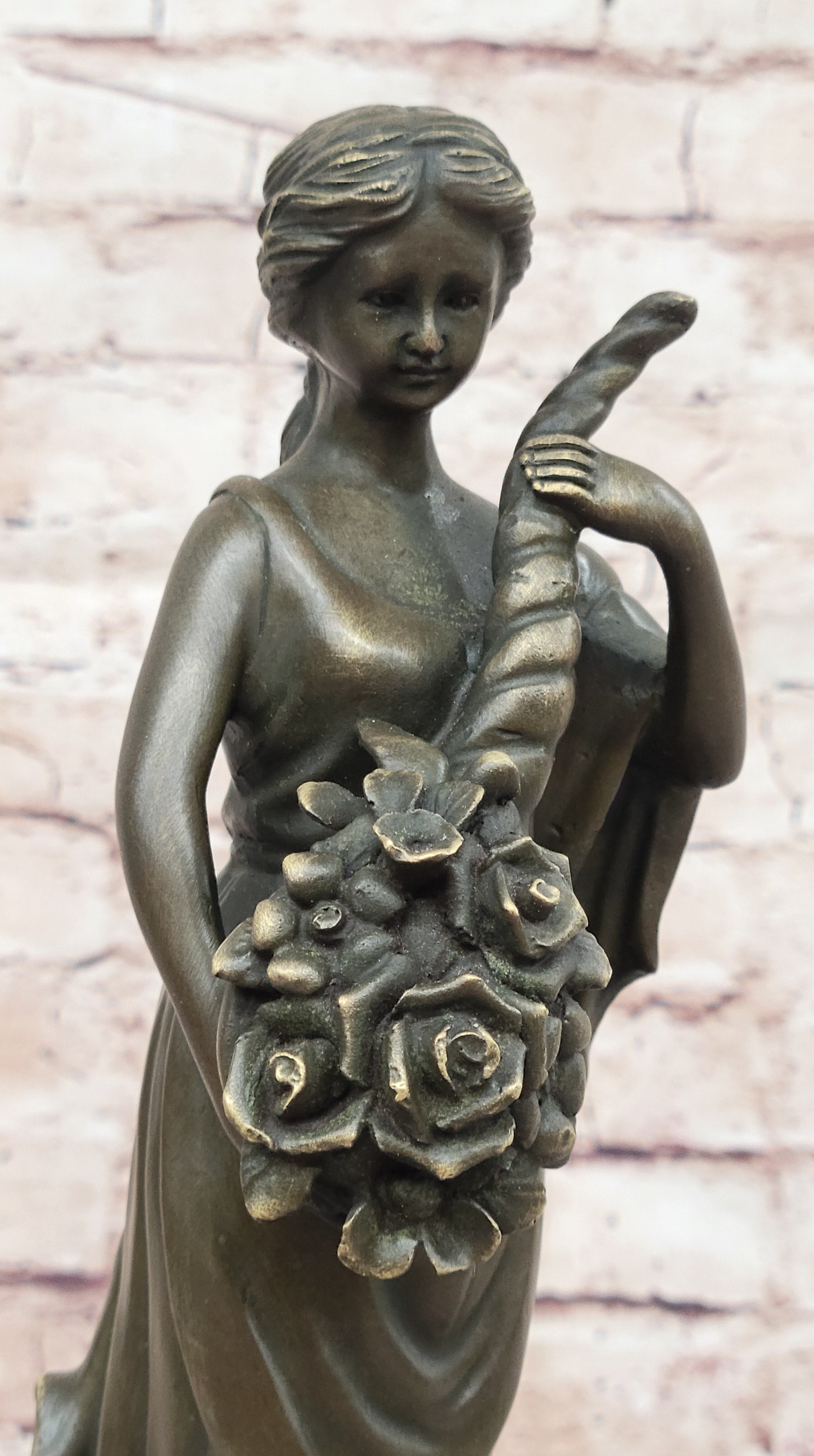 Female Figure Holding a Floral Cornucopia - Bronze Sculpture by Milo