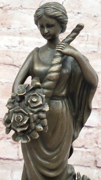 Female Figure Holding a Floral Cornucopia - Bronze Sculpture by Milo