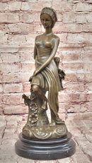 Young Girl Sitting on Tree Near Pond - Bronze Art by Milo